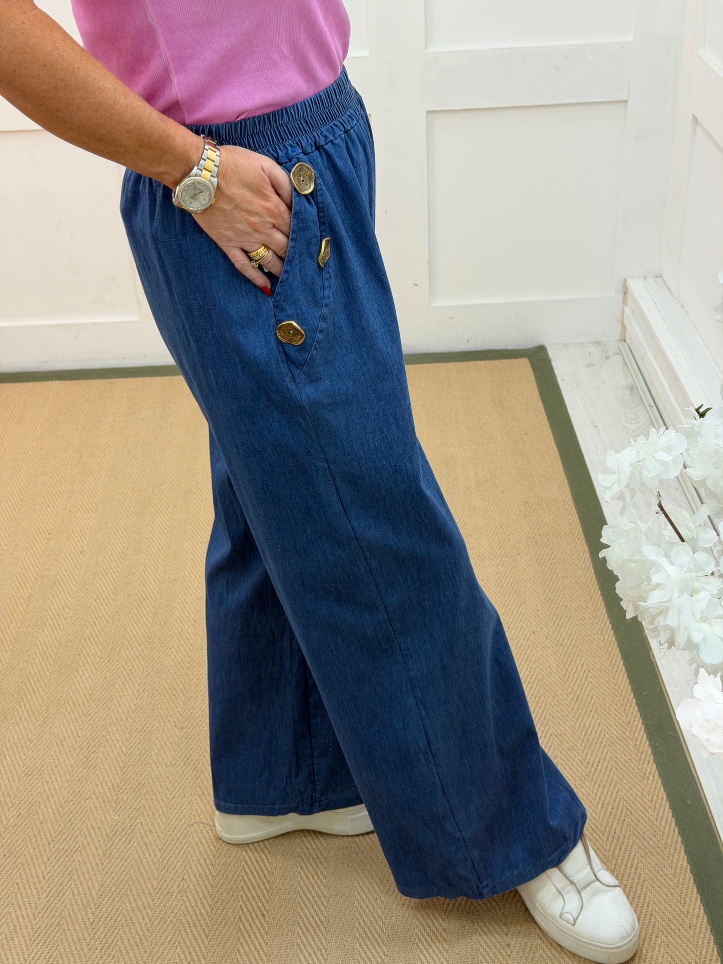 Denver: Mid denim gold button wide leg trousers. 12-18