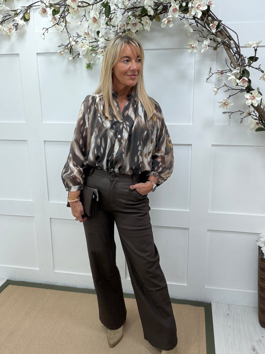 Brea: Brown animal print sheer blouse. One size: 12-18