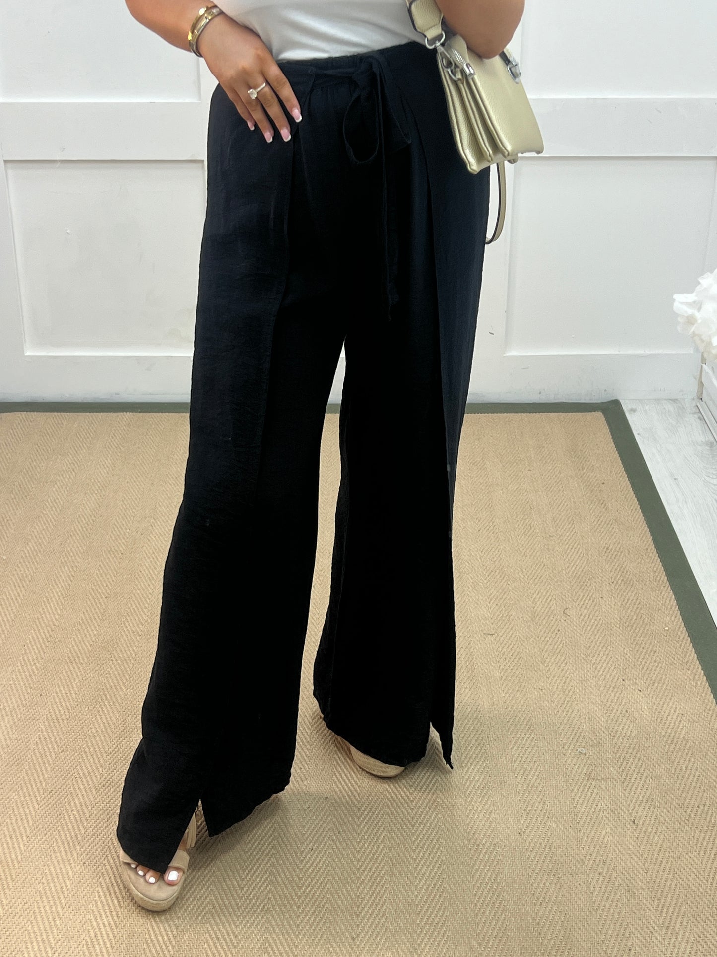 Eden: Black tie waist wide leg trousers. One size: 10-16