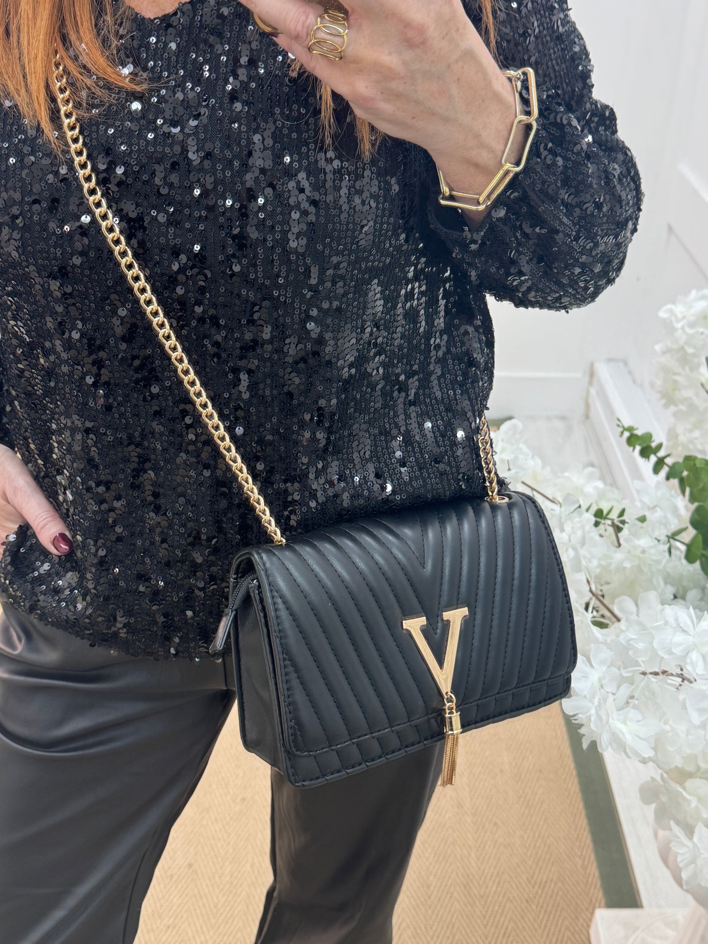Clare: Black quilted gold V evening bag
