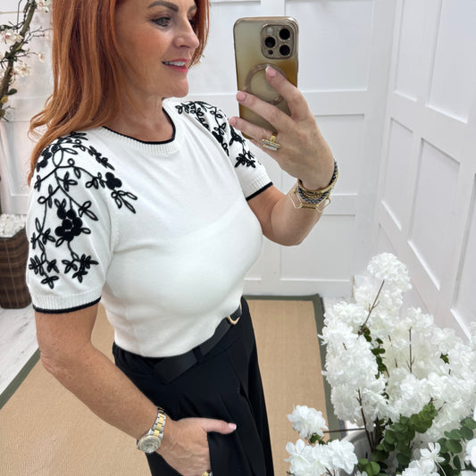 Henna: White stretchy knit embroidered top. 2 sizes