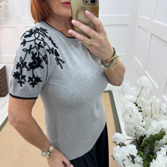 Henna: Grey stretchy knit embroidered top. 2 sizes