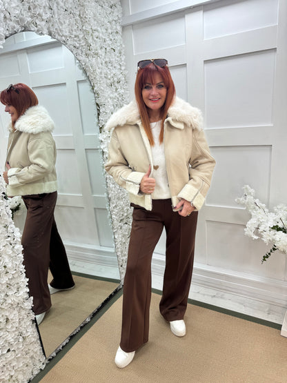 Fiora: Cream faux fur leather jacket. Two sizes