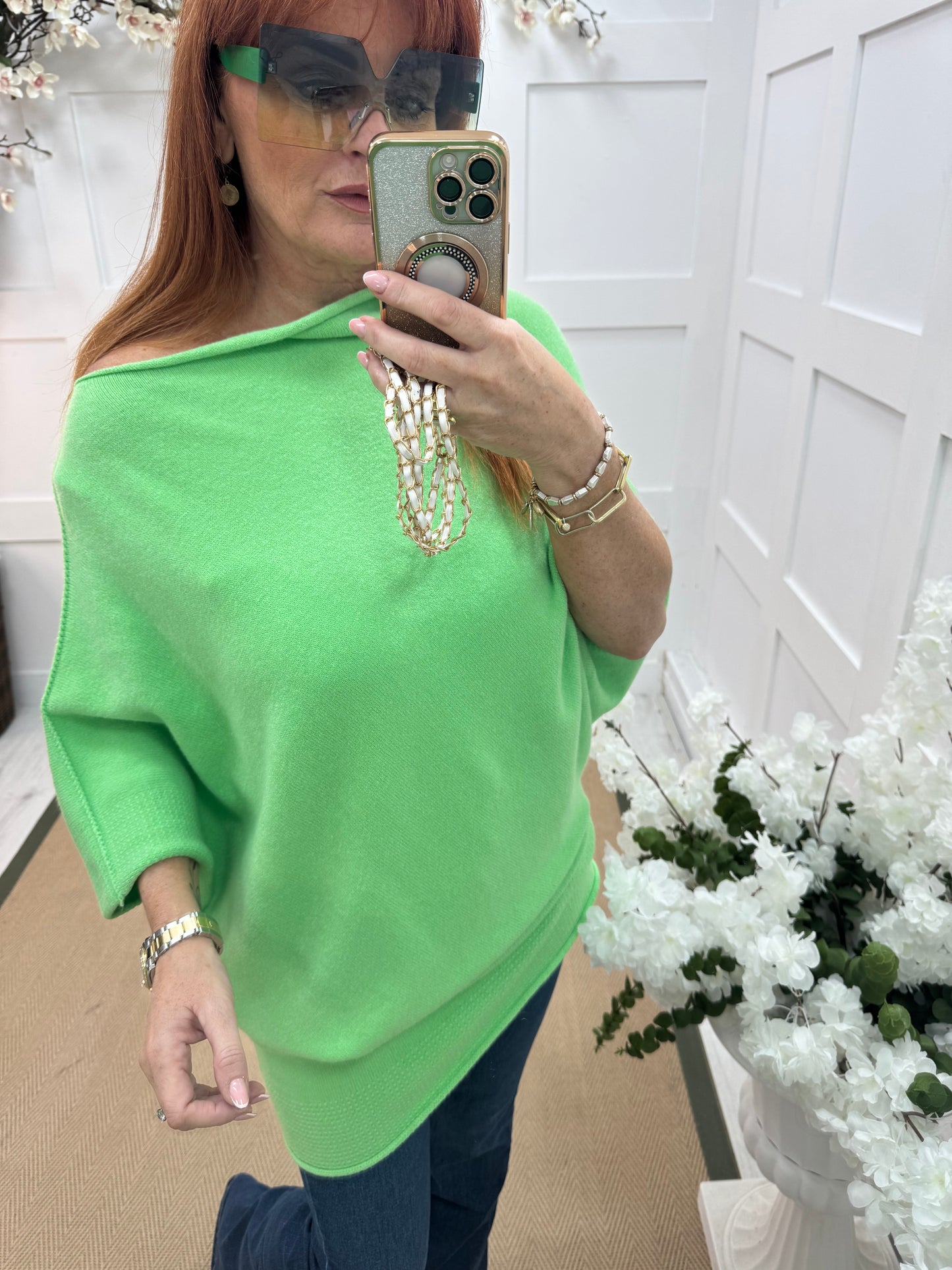Samantha: Vibrant green asymmetrical slouch top. One size 10-18