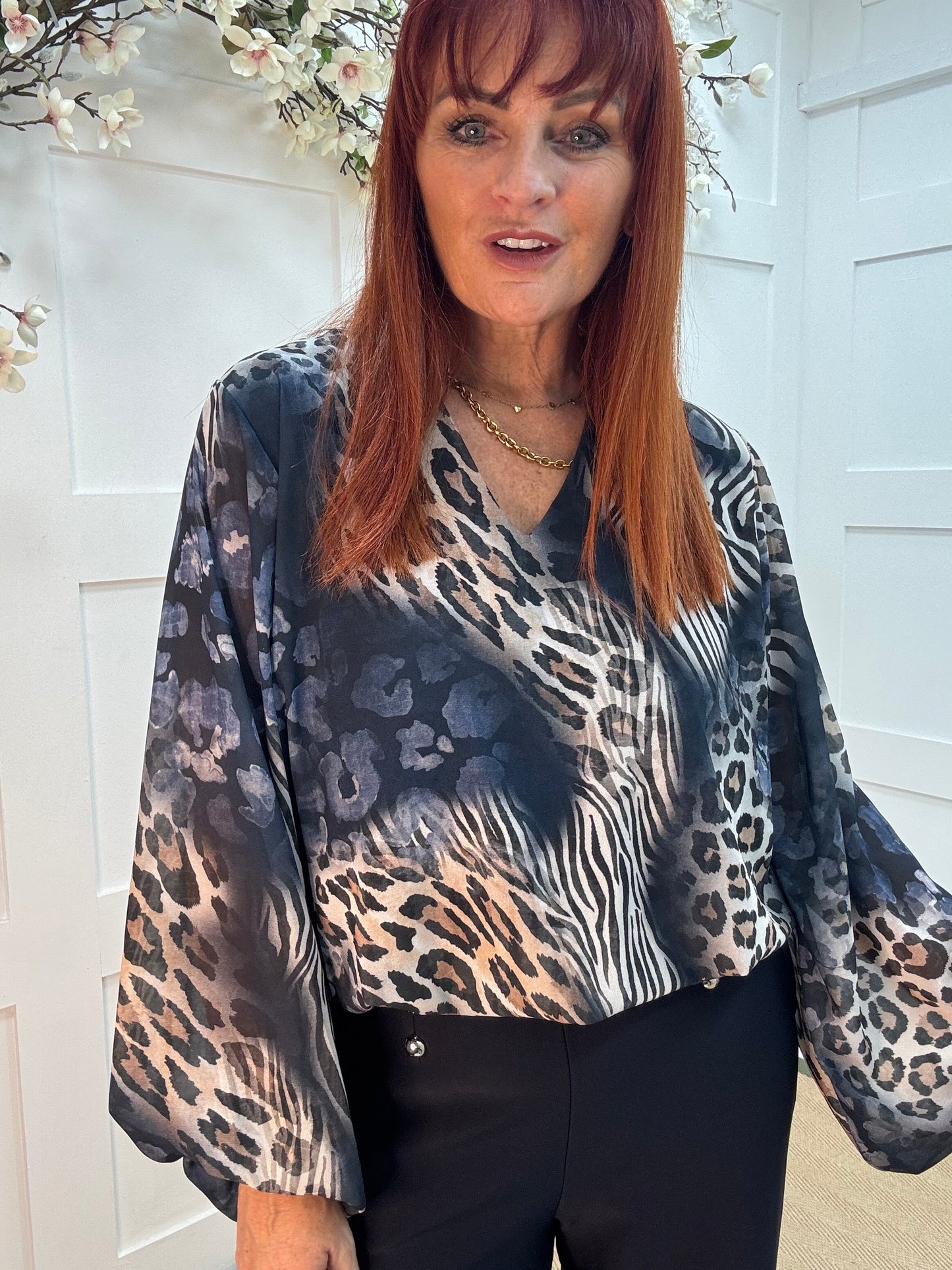 Vikki: Navy blue V neck animal print blouse. One size: 10-16
