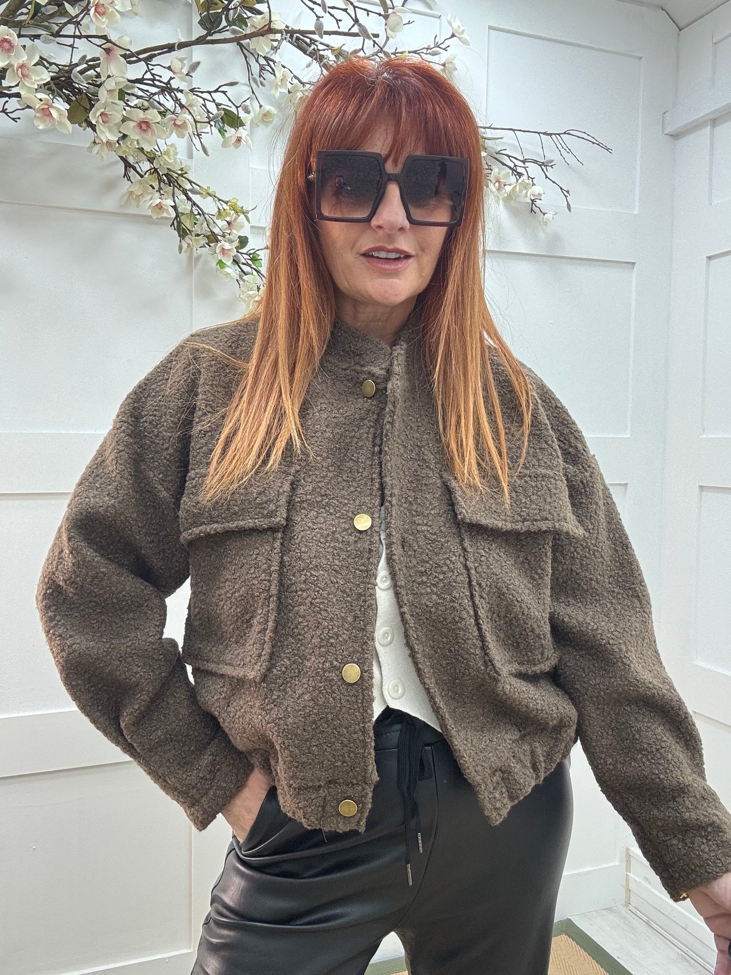 Kleo: Brown short boucle bomber jacket. One size: 12-18