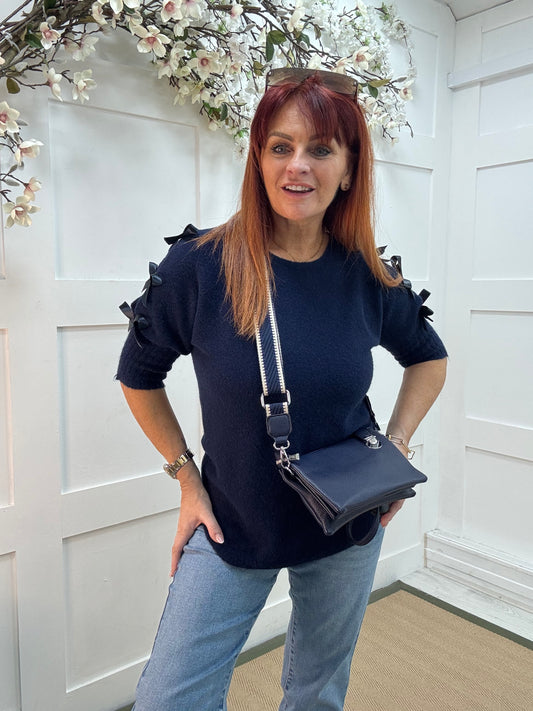 Britt: Navy three pocket crossbody bag.