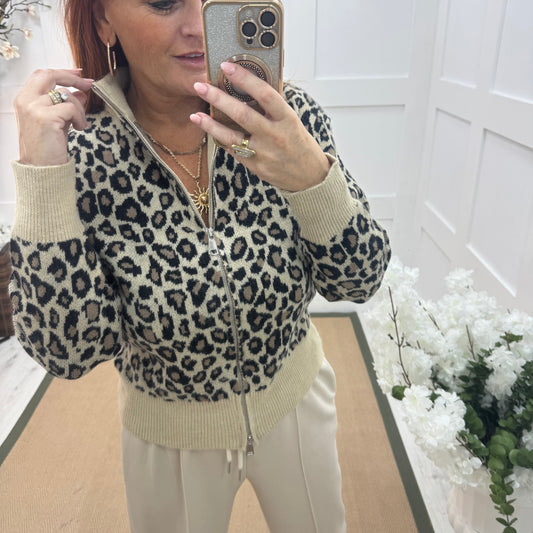 Ursula: Cream leopard print zipped neck top. One size: 12-18