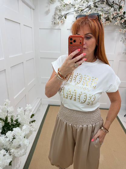 Aria: White & gold stud “MORE AMOR” T shirt. One size: 10-16