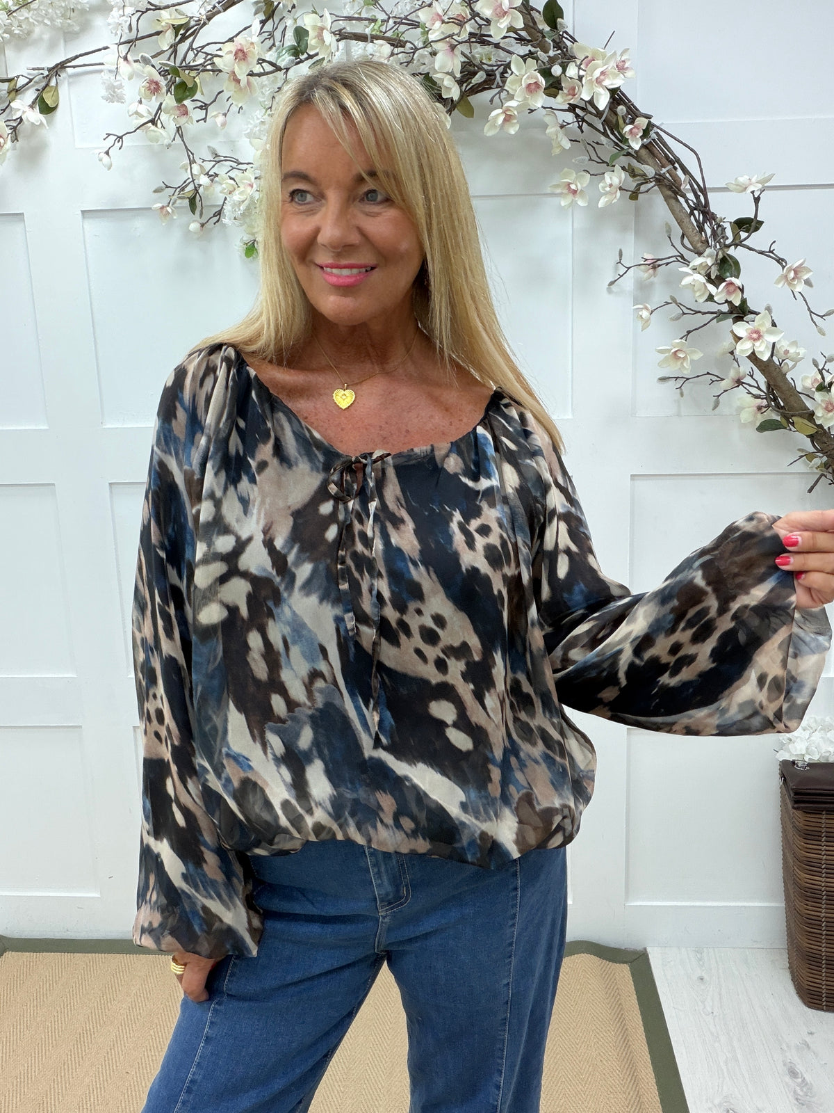 Farah: Blue animal print blouse. One size: 14-20