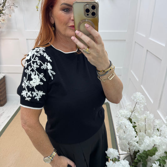 Henna: Black stretchy knit embroidered top. 2 sizes