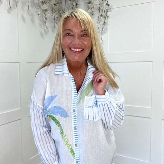 Stacie: Blue palm tree & script diamanté shirt. One size: 14-20