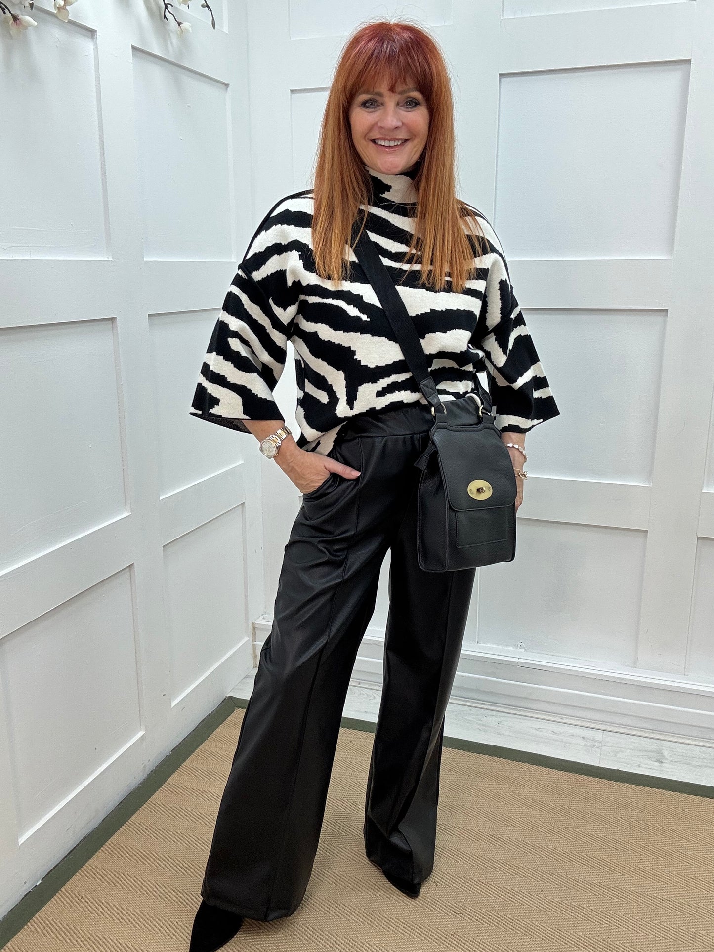 Tabatha: Black faux leather trousers. One size: 12-16