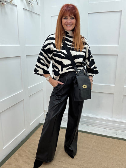 Tabatha: Black faux leather trousers. One size: 12-16