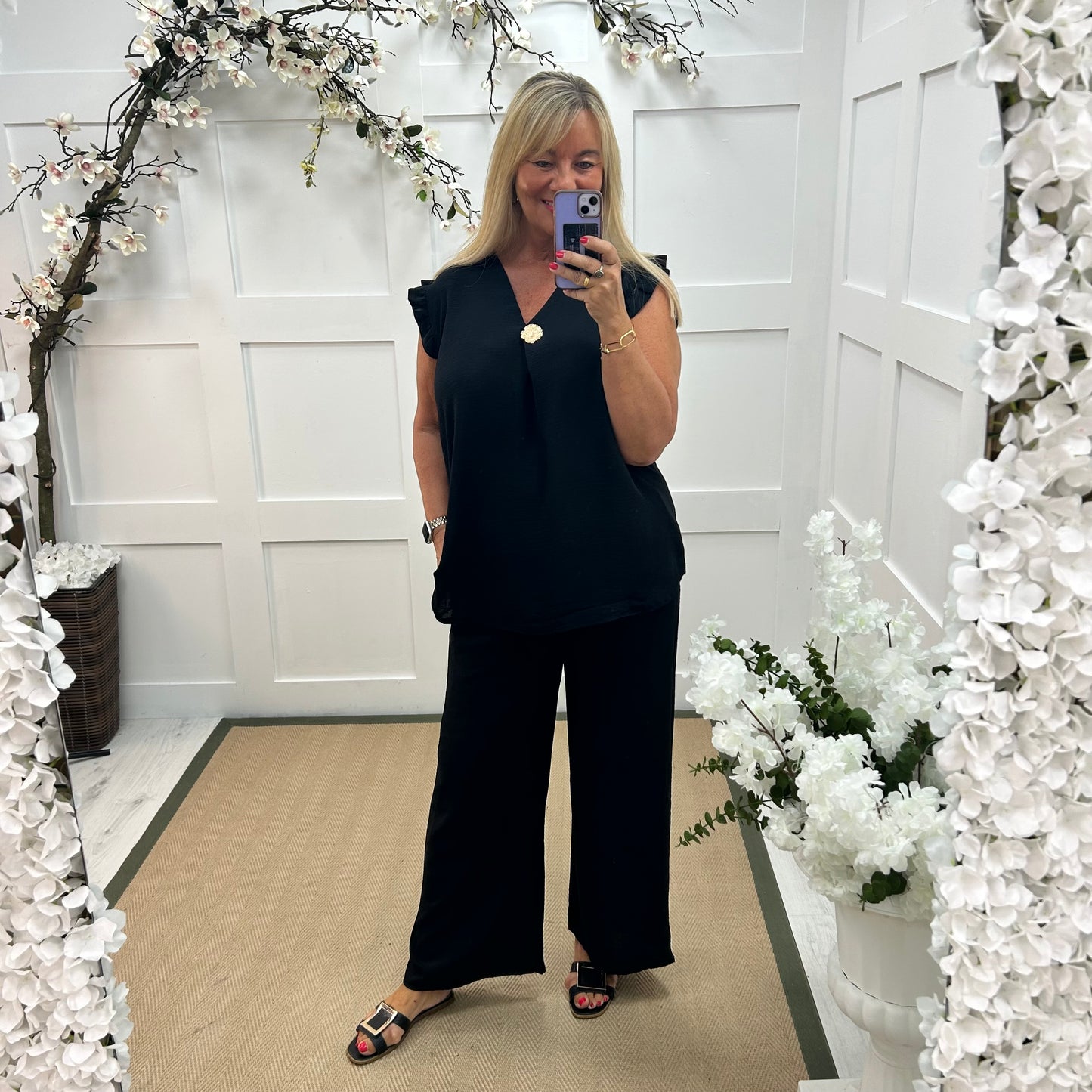 Drew: Black V neck button top. One size: 14-20