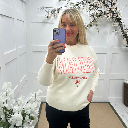 Melody: Cream textured MALIBU logo knitted top. One size 10-18
