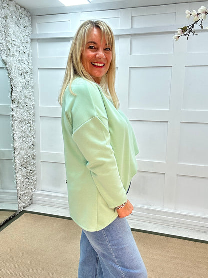 Phoebe: Mint over lay front oversized top . One size: 14-18