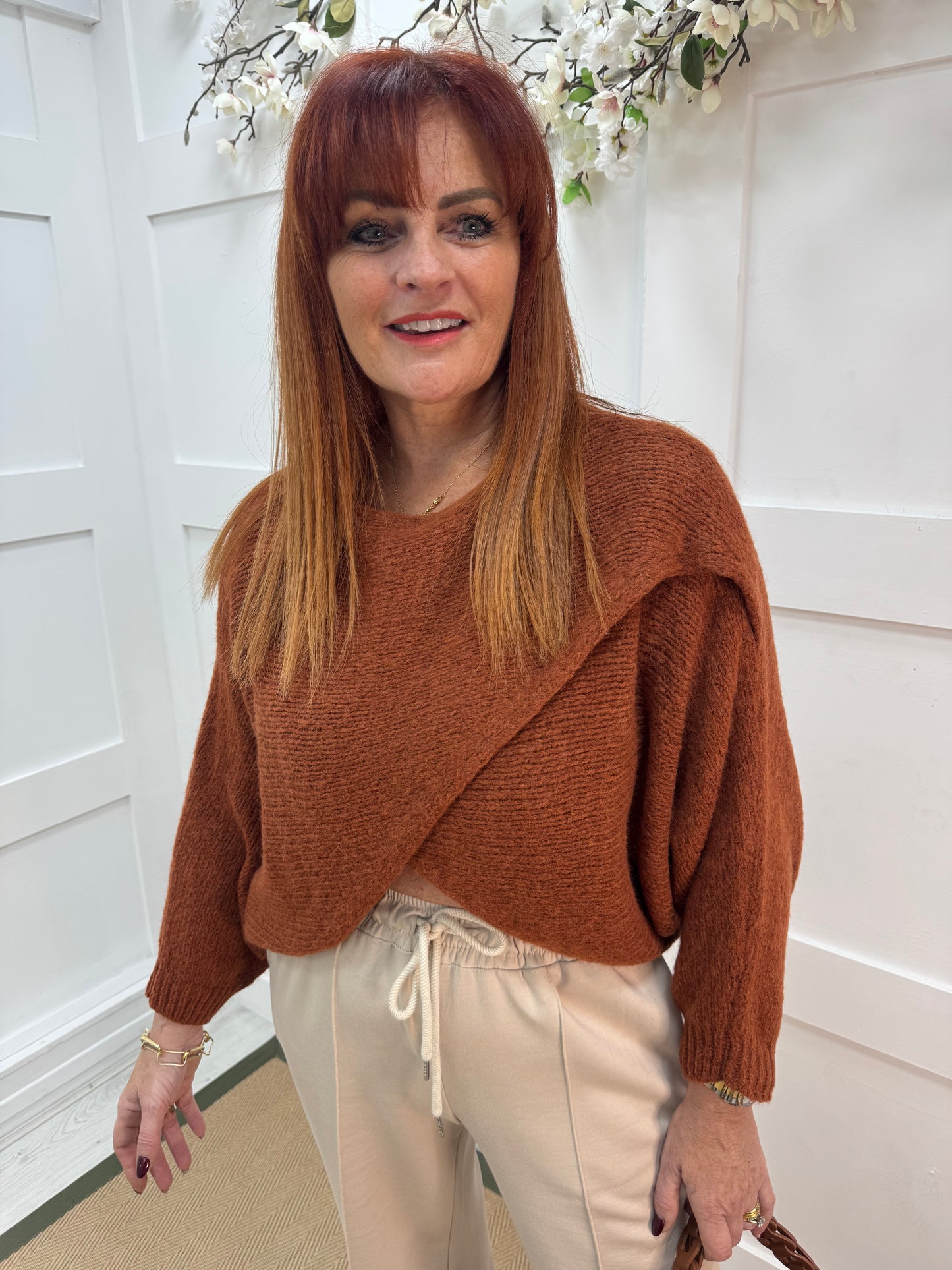 Willow: Burnt orange stretchy short wrap top. One size: 10-18