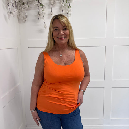 Abigail: Stretchy basic orange vest top. 2 sizes