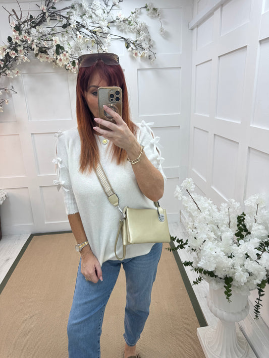 Britt: Gold three pocket crossbody bag.