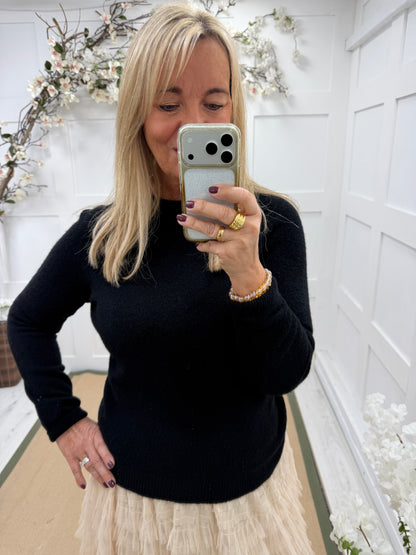 Pixie: Black long sleeve plain knit top. One size: 10-16