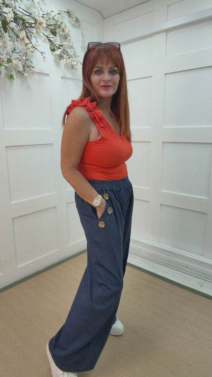 Denver: Mid denim gold button wide leg trousers. 12-18