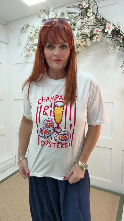 Orla: White & red “champagne & oyster” T shirt. 2 sizes.